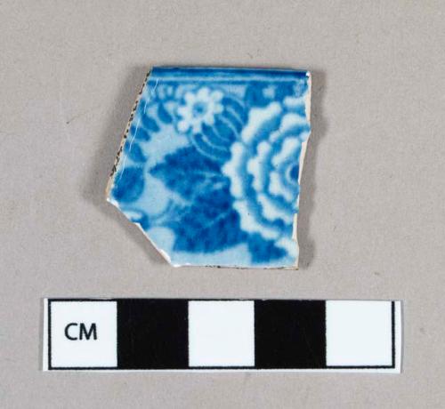 Ceramic, pearlware rim sherd with blue transfer print floral decoration