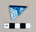 Ceramic, pearlware rim sherd with blue transfer print floral decoration on interior and exterior