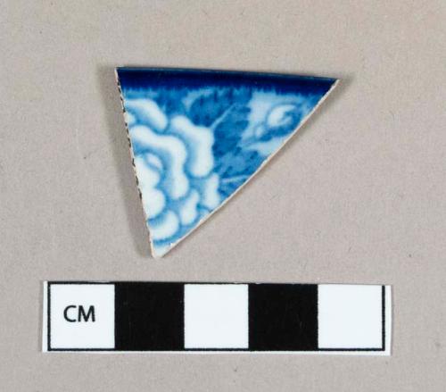 Ceramic, pearlware rim sherd with blue transfer print floral decoration on interior and exterior