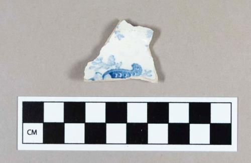 Ceramic, whiteware base sherd with blue transfer print decoration on interior