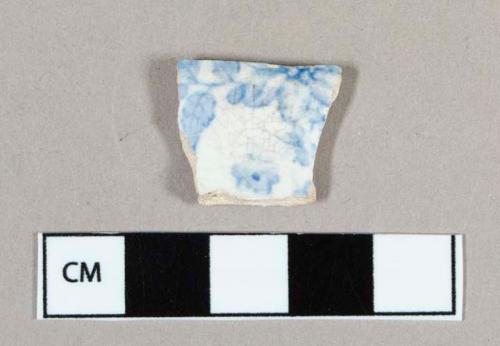 Ceramic, whiteware body sherd with blue transferprint botanical decoration on interior