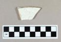 Ceramic, whiteware body sherd with molded floral design