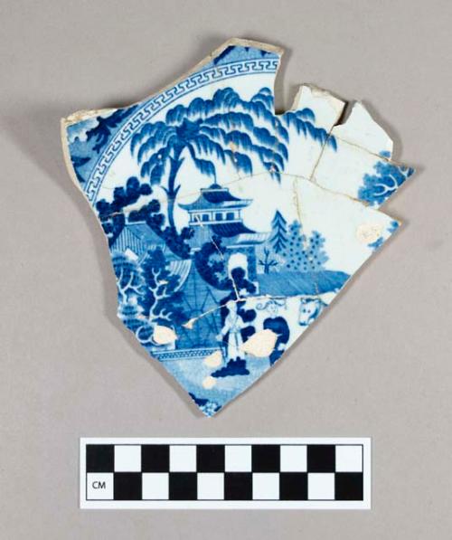 Ceramic, pearlware plate fragment, mended, blue transferprint of landscape, two men, and a zebra