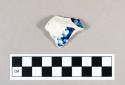 Ceramic, pearlware body sherd with blue transfer print floral decoration on interior