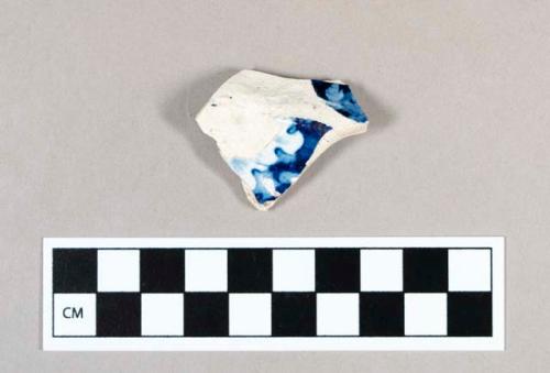 Ceramic, pearlware body sherd with blue transfer print floral decoration on interior