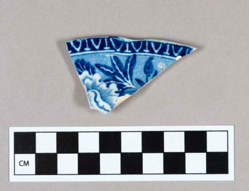 Ceramic, pearlware rim sherd with blue transfer print floral decoration on interior