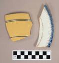 Ceramic, pearlware rim sherd with blue feather edge, and yellowware rim sherd with blue banded incised decoration on exterior