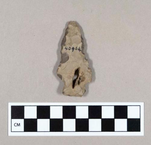 Chipped stone, side-notched projectile point, with natural perforation, and reworked edges