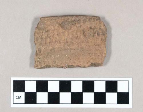 Ceramic, earthenware rim sherd with punctate inside, raised dot and impressed pattern on outside