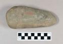 Ground stone axe with shallow groove