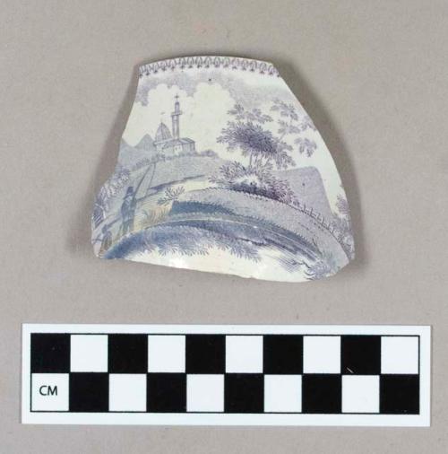 Ceramic, whiteware teabowl fragment, with purple transfer print floral on interior and landscape pattern on exterior