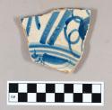 Ceramic, tin glazed earthenware body sherd with hand painted blue decoration on interior