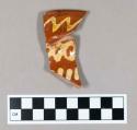 Ceramic, slipware with red body and white slip decoration, rim sherd of platter or dish