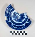 Ceramic,  whiteware bowl fragment, flow blue style transfer print intererior, and makers mark: "Temple / Pearl Stone" at base