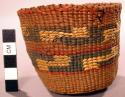Basket, woven grass, rounded base, cylindrical, polychrome geom. design
