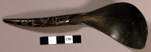 Chilkat horn spoon. Short handle with incised designs.