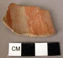 Rim potsherd - white on red, both surfaces (Wace & Thompson, 1912, Type A 3 [alp