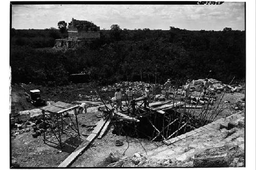 Caracol. Trench at base of upper stairway showing poles placed to prevent walls