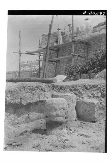 Caracol. S. Annex Bench House, stone head found on floor.