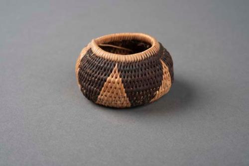 Very small basket, flat bottom, inverted rim -diameter of rim 1.125 in.