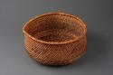 Large twined circular bowl-shaped basket of twigs and martynia pod