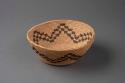 Coiled bowl-shaped basket with flaring sides and stepped parallel line motif