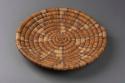 Basket, coiled plaque, poly geo design, slightly raised center & rim