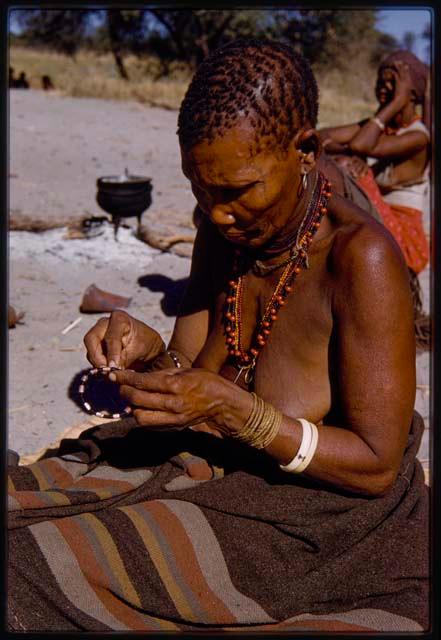 Woman making a bracelet