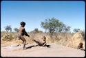 Children, Toys: /Gaishay (son of ≠Toma) pulling !Ungka Norna on a kaross down a termite mound