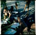 Painting: Children painting, with Elizabeth Marshall sitting next to them