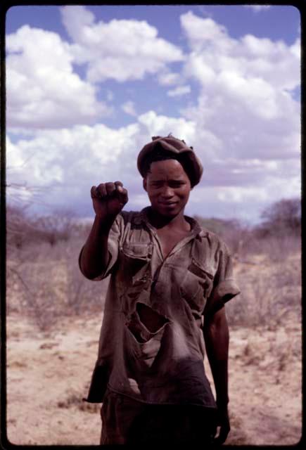 N!o (brother of !Ani) demonstrating hunting hand signal for 'lion'