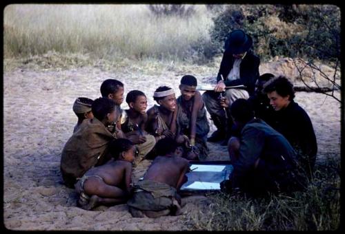 Lorna Marshall, Elizabeth Marshall Thomas, and Kernel Ledimo drawing with a group of people