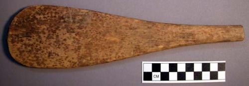 Wooden paddle used for stirring food