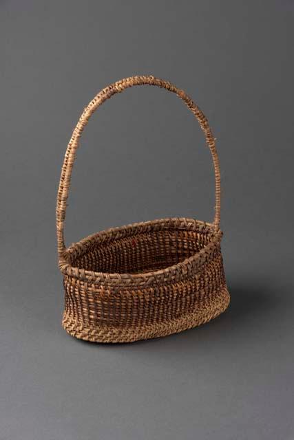 Bamboo basket with handle, made by schoolboy, luru, of pangia village