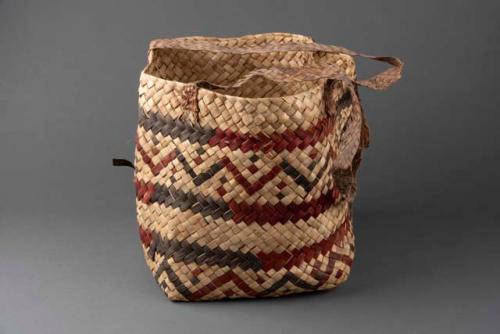 Large rectangular carrying basket.  Decorated with red and black