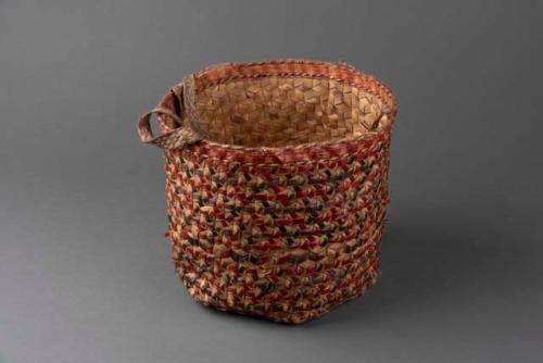 Carrying basket, hexagonal bottom of large fibres. Decorated in brown,+