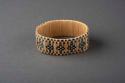 Decorated raffia napkin ring(?)