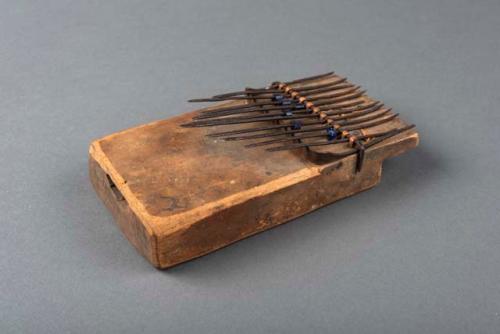 Musical instrument with sounding board and iron keys