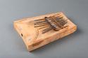 Thumb piano; carved wood body; perf'd; metal keys & supports