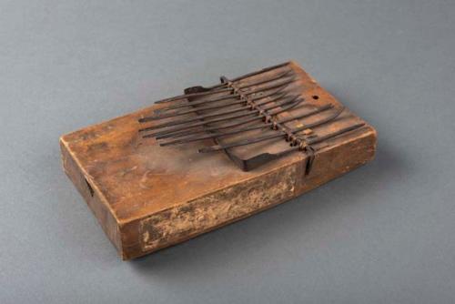 Small hand piano - metal keys, wooden sounding box