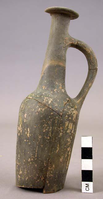 Pottery vase, hard brown ware, black slip, white painted decoration handle, elon