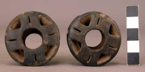 Pair of perforated pottery ear plugs