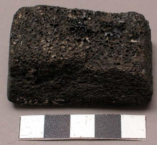 Block of lava with which vanes of feathers rubbed