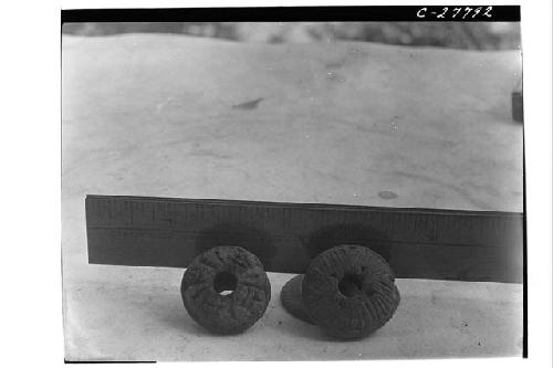 Spindle whorls, incised rosettes - Temple of the Interior Columns and House of G