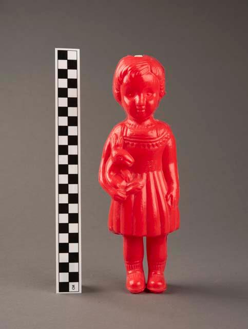 Plastic sculpture depicting a twin, one of a pair