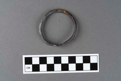 Metal bracelet, one of a group of eight.