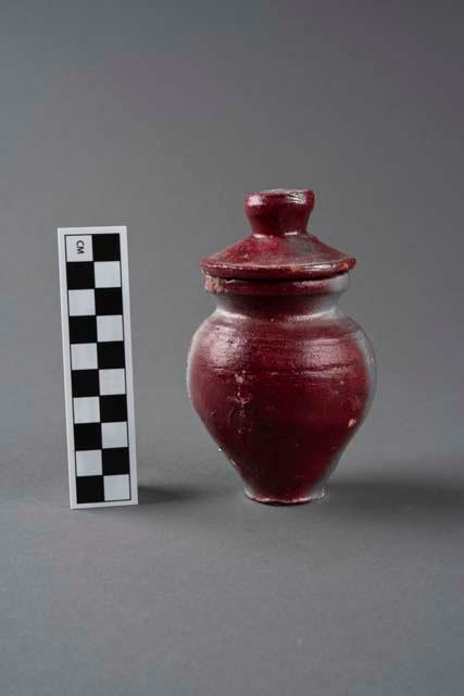 Terracotta container and lid, one of a pair