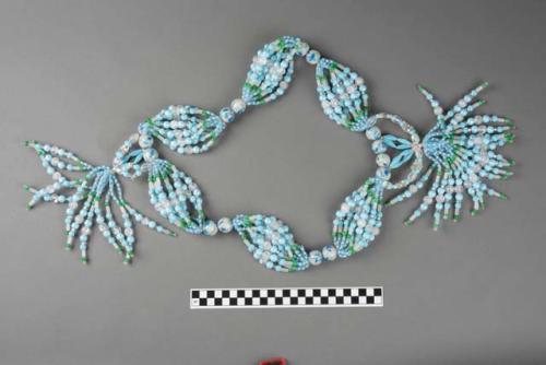 Necklace of plastic corals, one of a group of three.