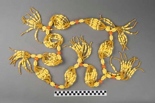 Necklace of plastic corals, one of a group of three.