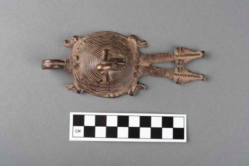 Bronze pendant depicting a double headed lizard and pregnant woman.